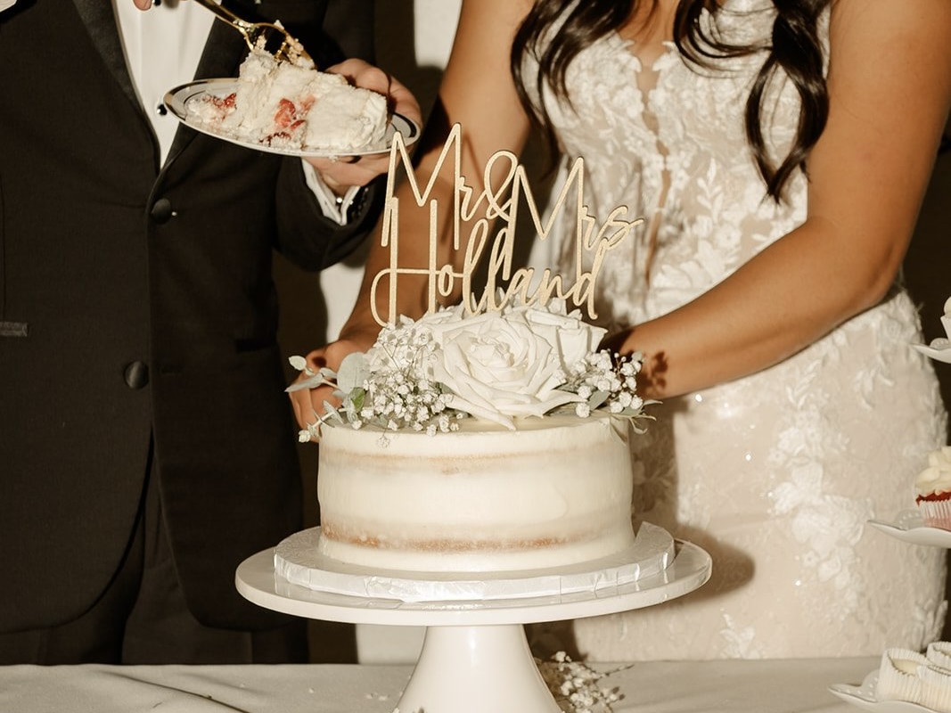 Couple cutting wedding cake